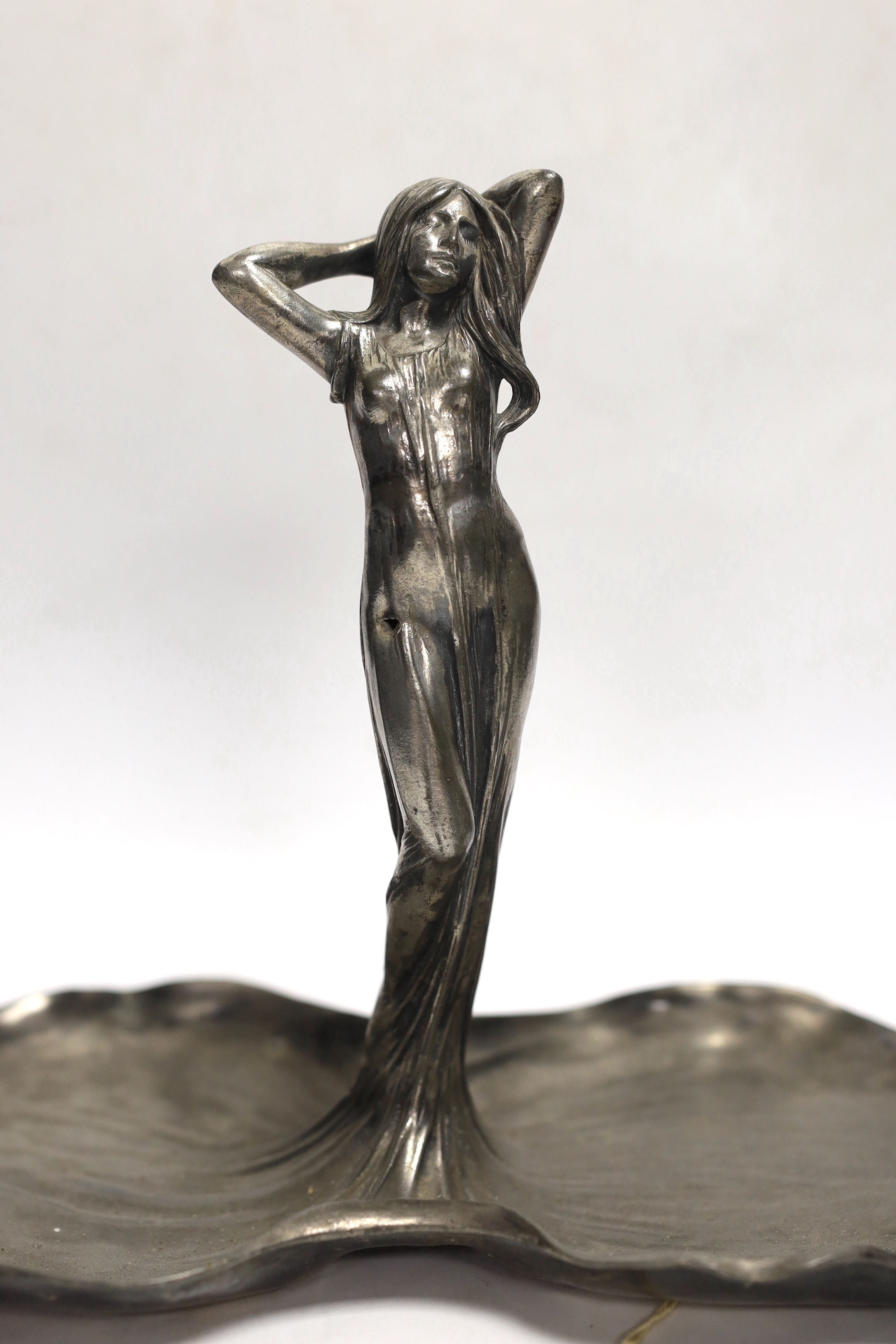 An Art Nouveau WMF pewter dish with a figure of a woman on lily pads, 22cm high